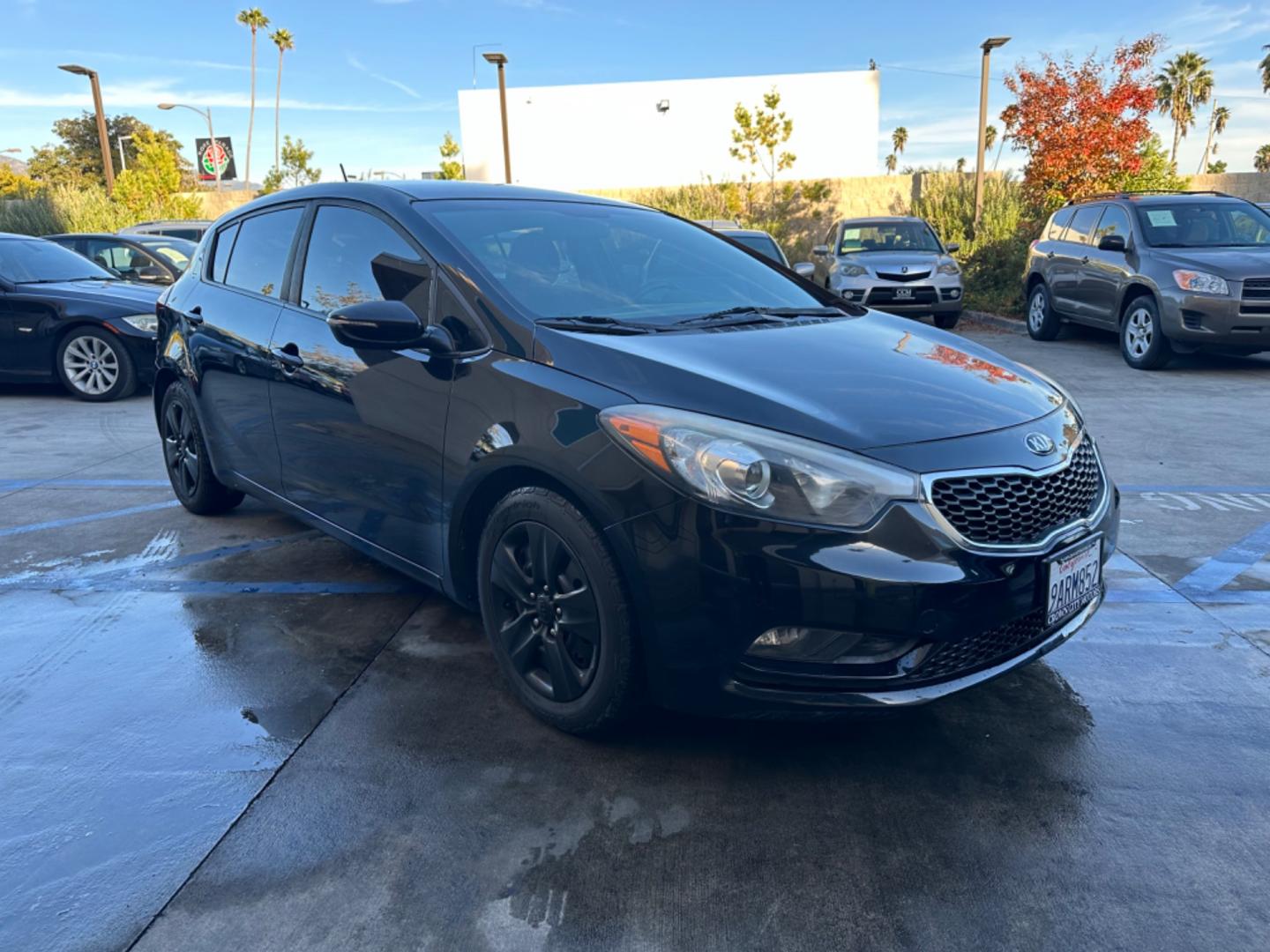 2016 Black /Black Kia Forte 5-Door Cloth (KNAFK5A87G5) with an 4 CYLINDER engine, Automatic transmission, located at 30 S. Berkeley Avenue, Pasadena, CA, 91107, (626) 248-7567, 34.145447, -118.109398 - Embark on a Journey of Style and Efficiency with the 2016 Kia Forte Hatch - Now Available at Our Premier Pasadena, CA Dealership Welcome to our BHPH dealership in Pasadena, CA, where we proudly present the 2016 Kia Forte Hatch, a vehicle that seamlessly blends stylish design, modern technology, a - Photo#6